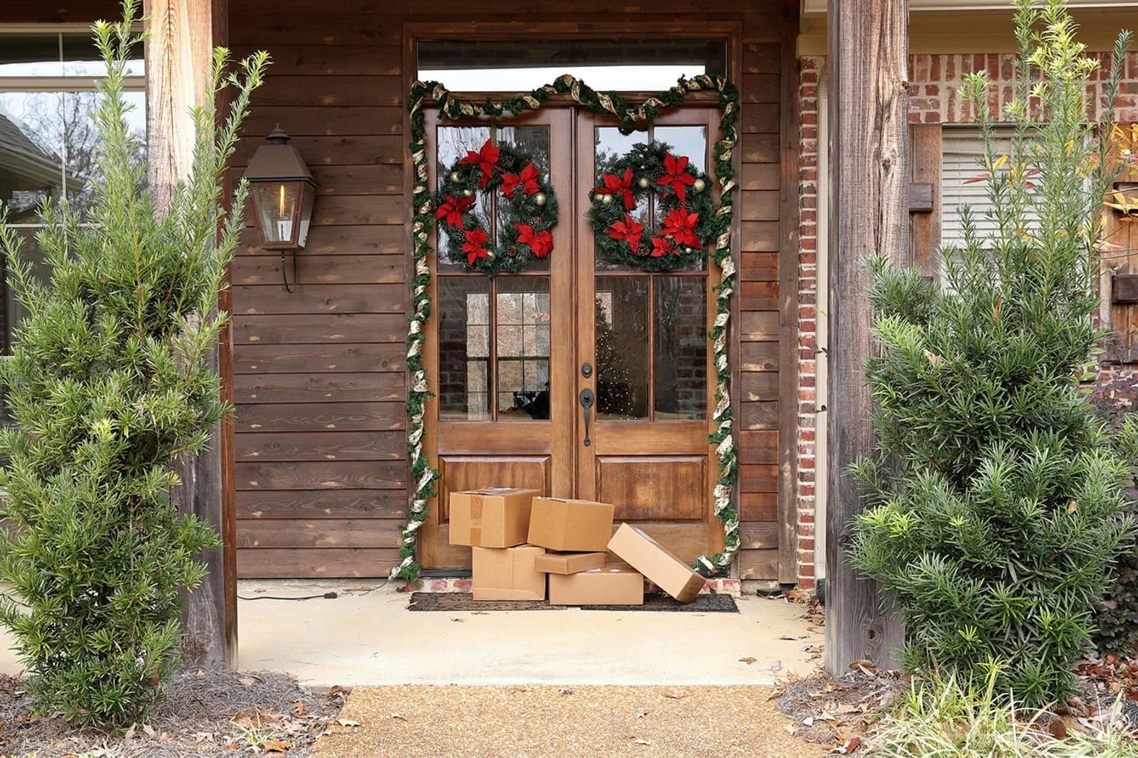 A front door with moving boxes stacked on the doorstep.