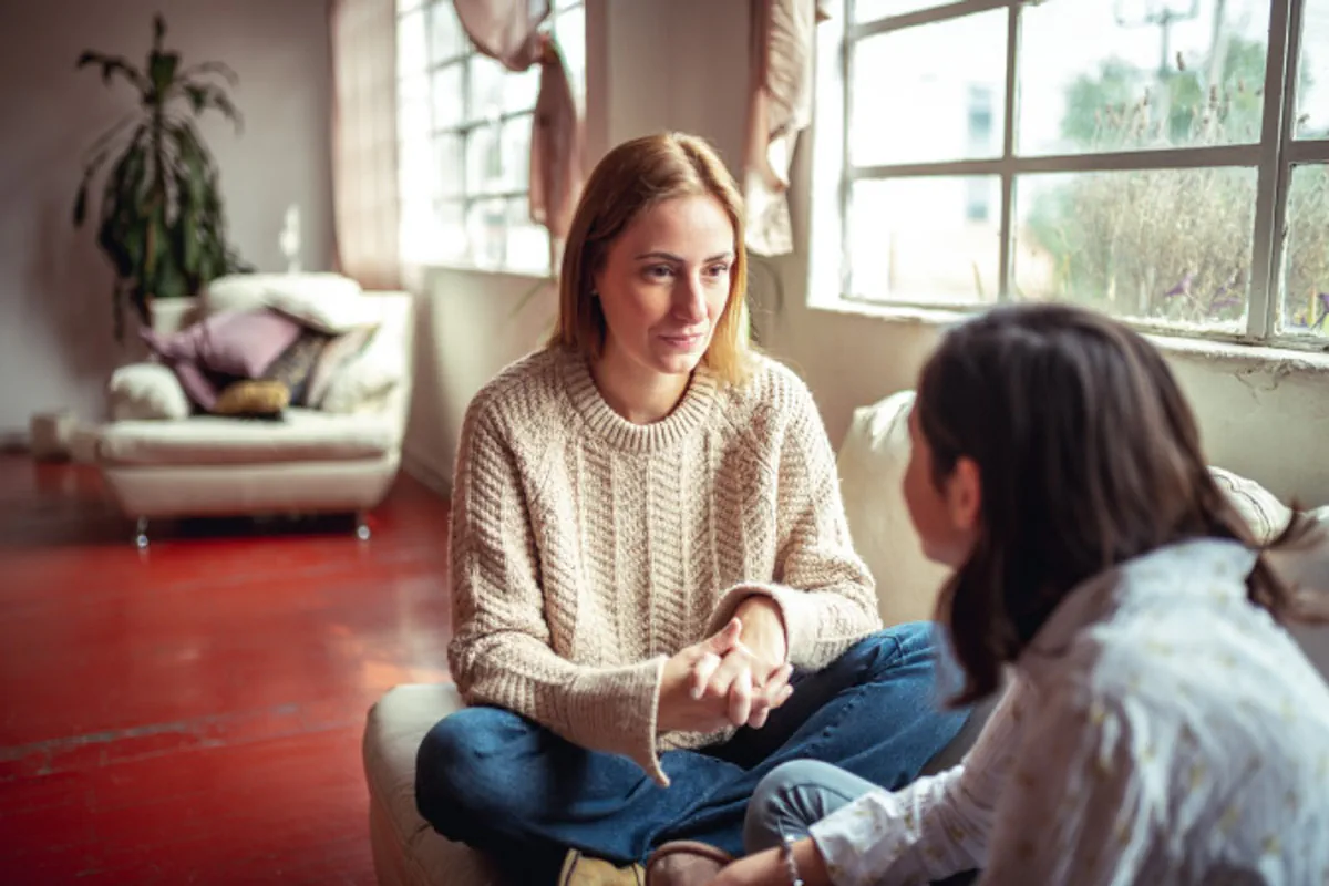 A mother and daughter talk together about an upcoming move.