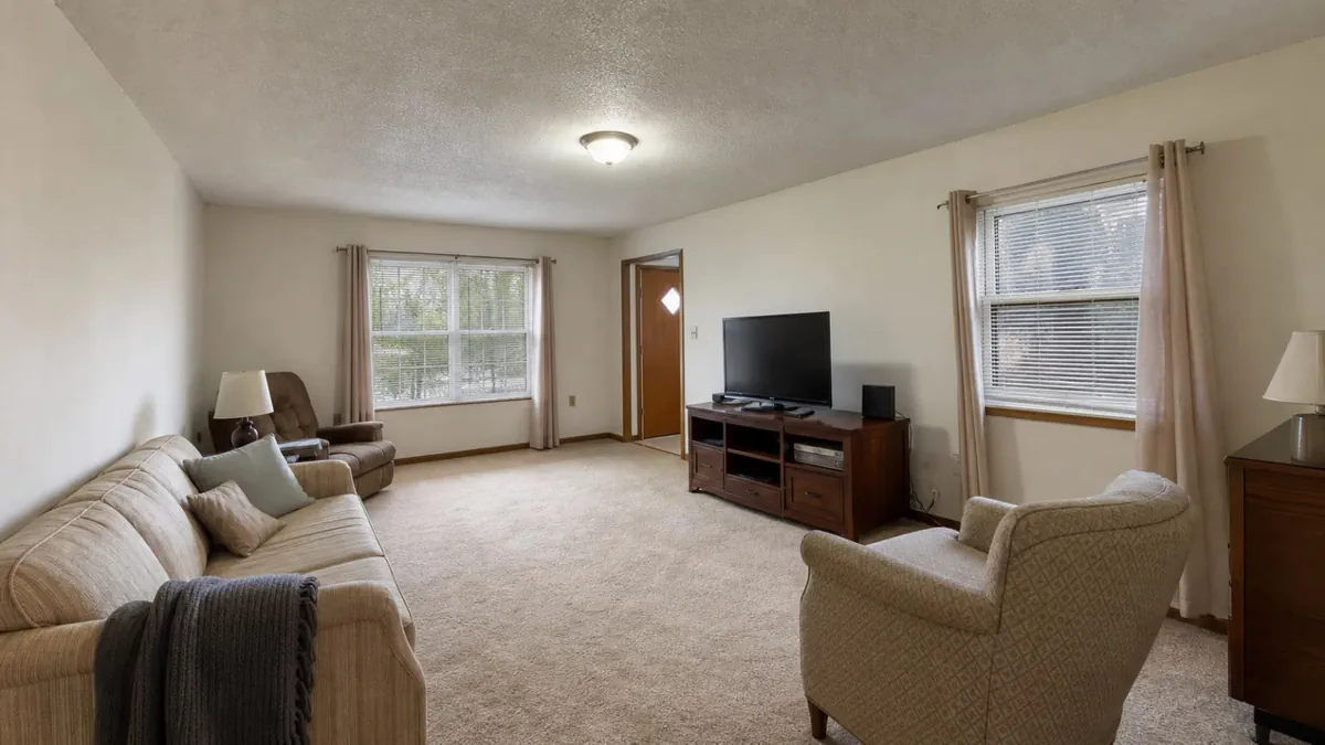 An existing living room photographed before furniture-layout exploration