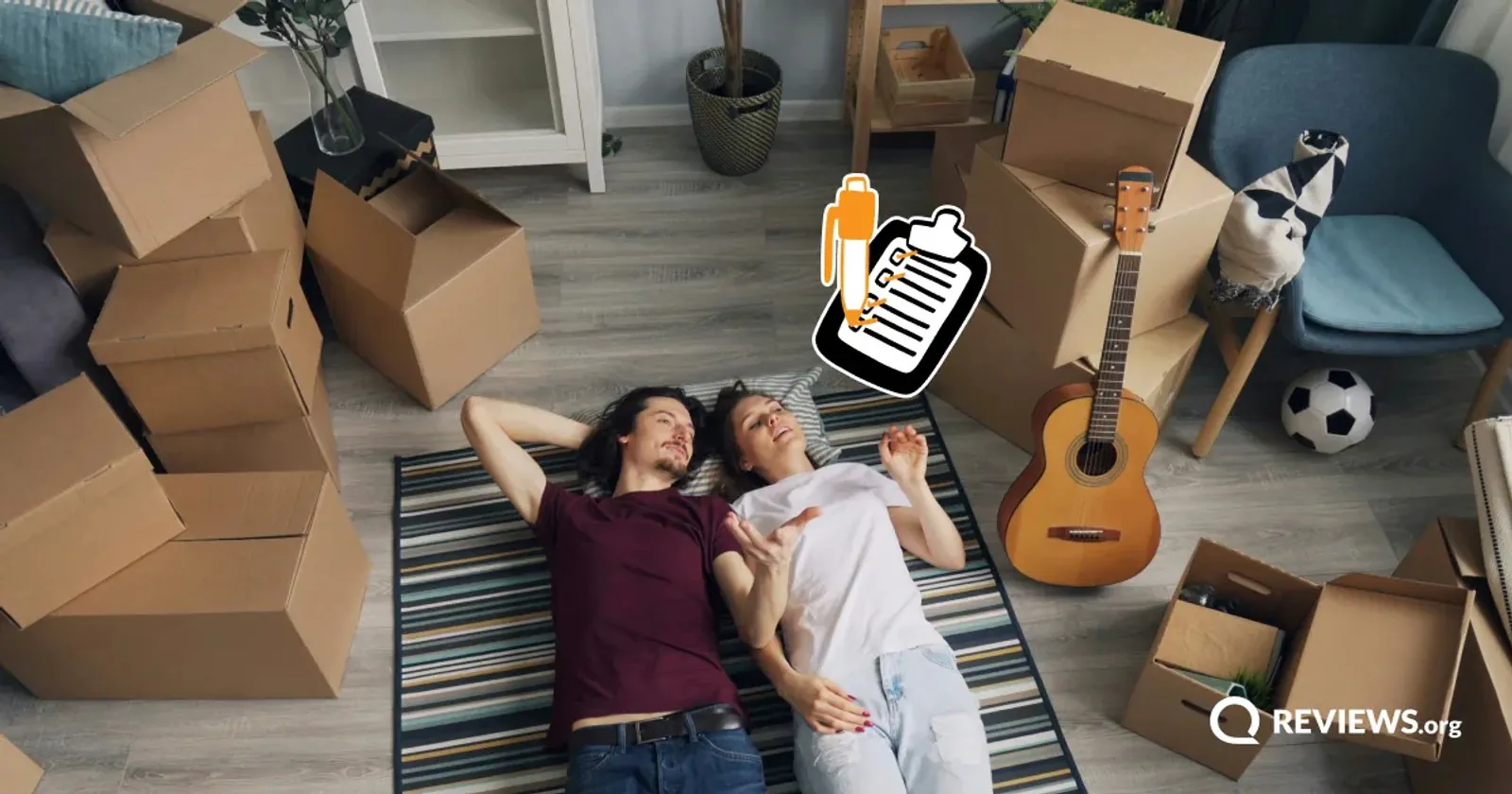 A couple relaxes among packed boxes and a moving checklist.
