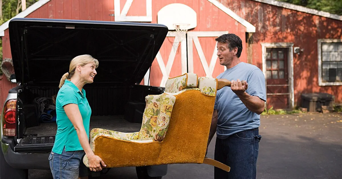 Couple moving antique chair